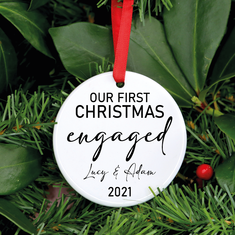 Our personalized ceramic ornament is perfect for all newly engaged to hang on their Christmas tree! This ornament is personalized with your names and year.
